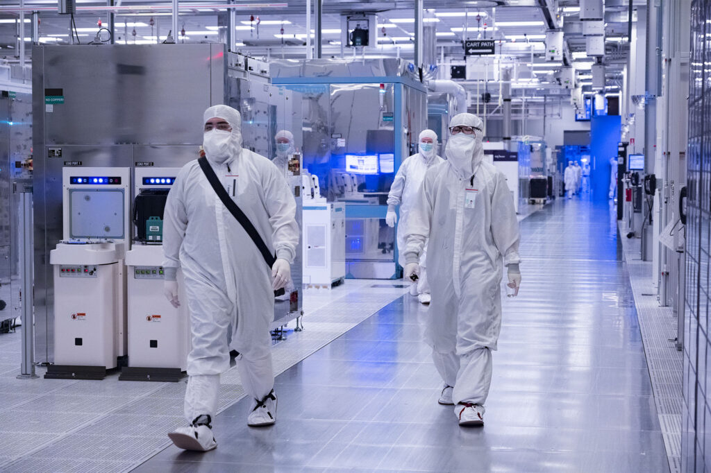 A photo from November 2021 shows employees in cleanroom “bunny s
